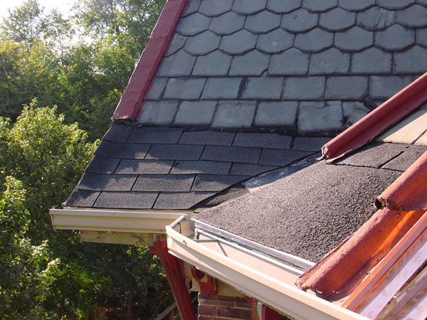 One Way To Install Standing Seam Copper Snow Aprons on a Slate Roof