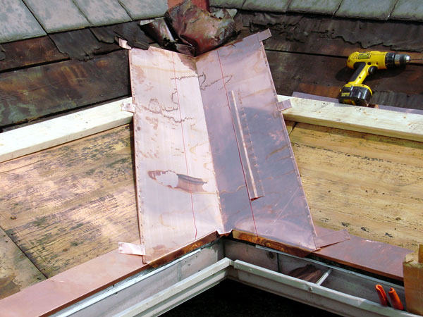 One Way To Install Standing Seam Copper Snow Aprons on a Slate Roof